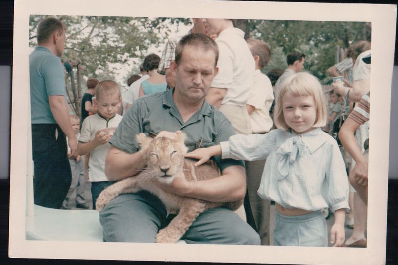 Mom petting a lion cub at the Cincinnati Zoo c 1964